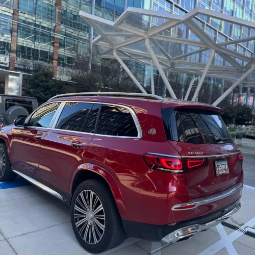 Red Maybach GLS rear side profile with Maybach wheels